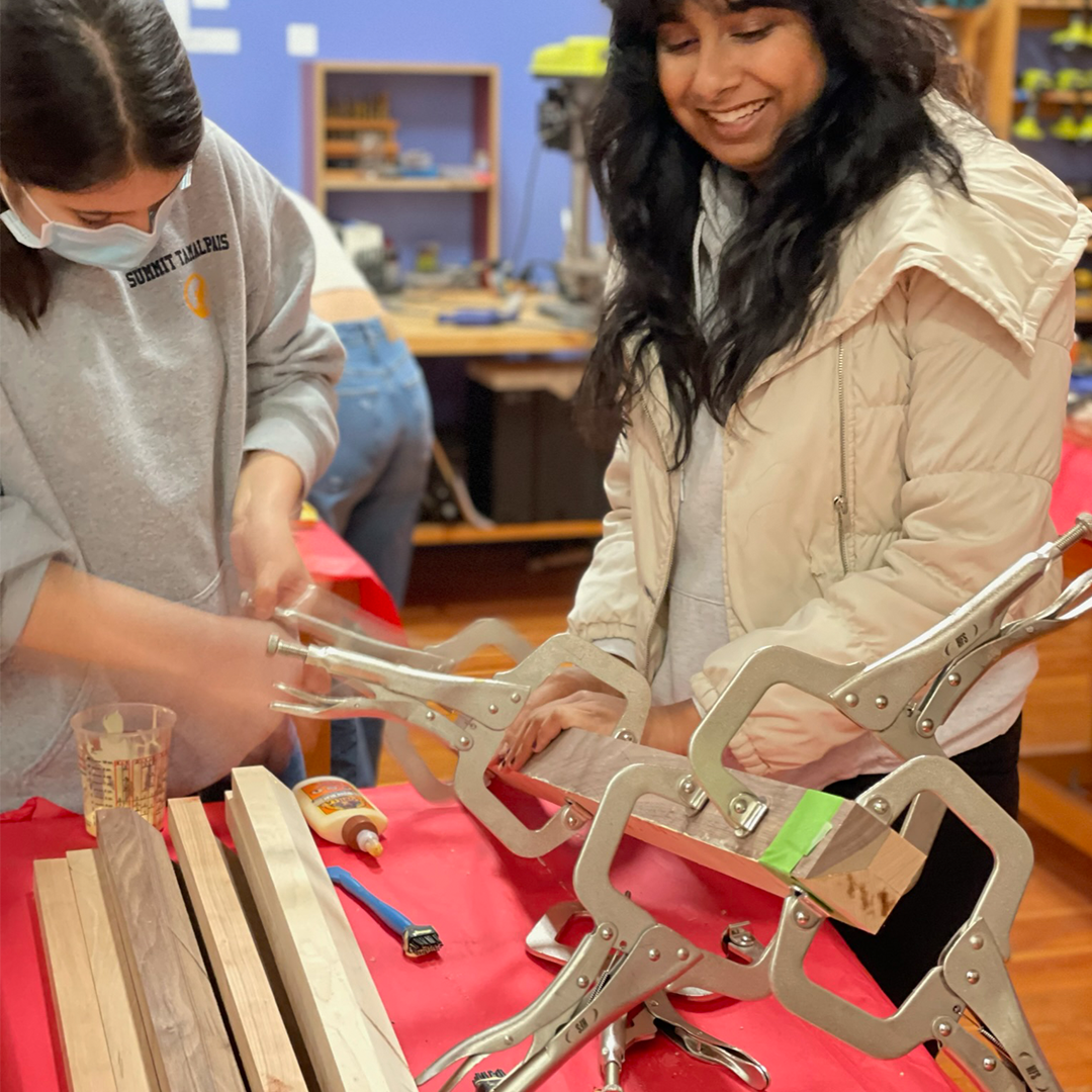 Girls Garage students clamping hardwood